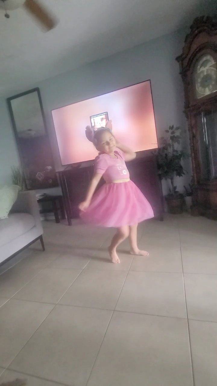 Khaleesi dancing in a pink dress